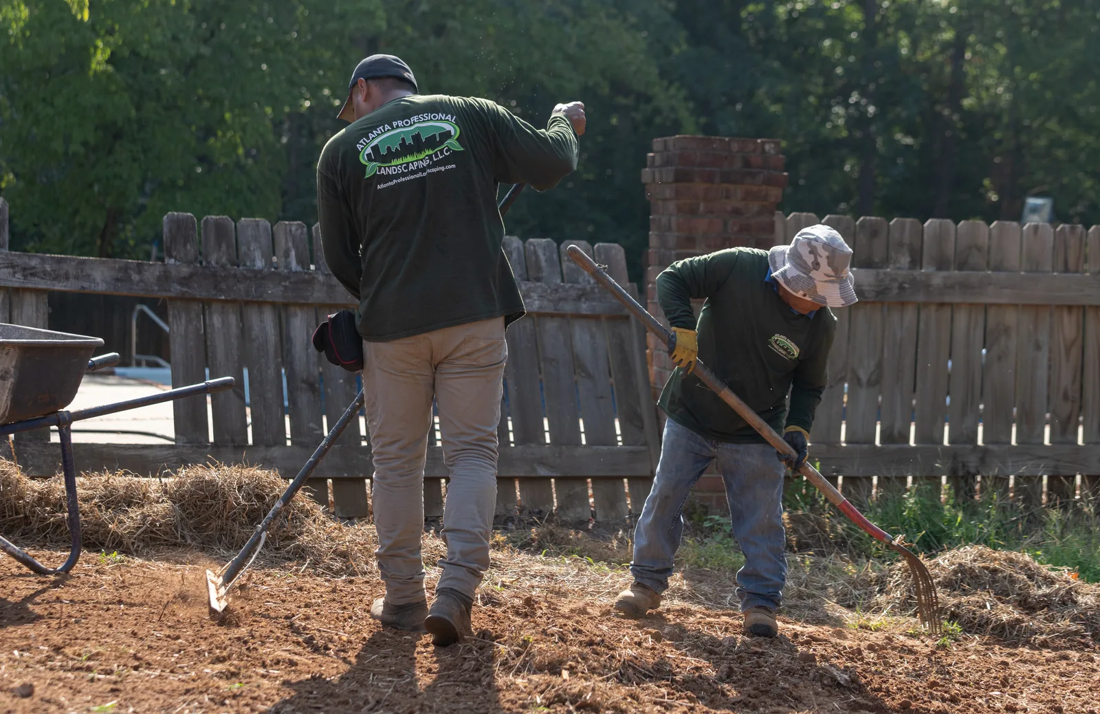Crew raking and spreading soil