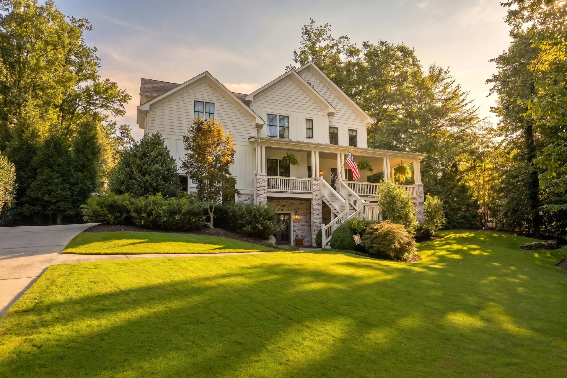 White farmhouse with a manicured front lawn